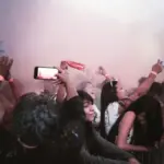 Penonton menikmati konser di barisan depan